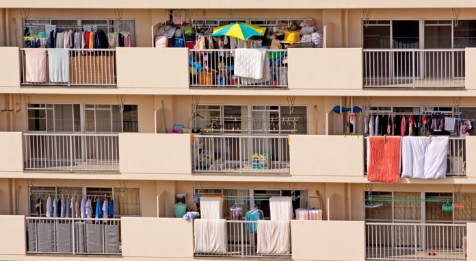 A view of several apartment balconies obviously in use as extra storage
